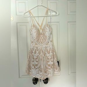 White and nude spaghetti strap romper. Never worn from Lulus.